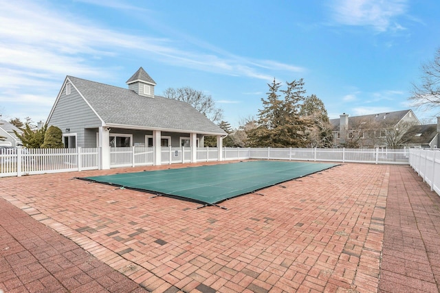 view of swimming pool featuring a patio