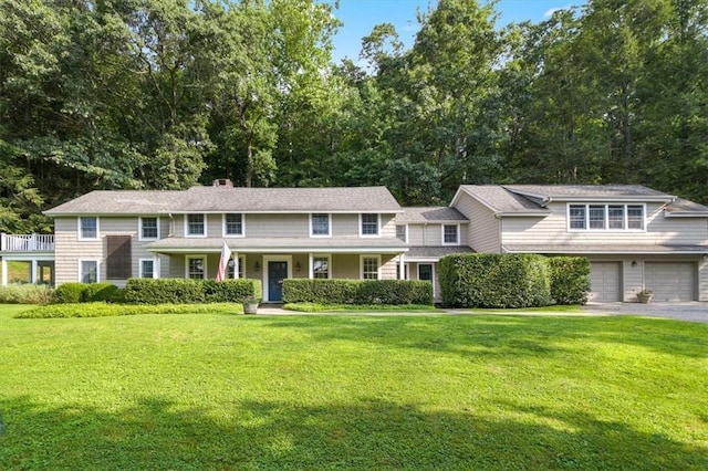 view of front facade with a garage and a front lawn