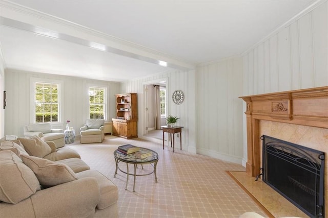 carpeted living room featuring ornamental molding and a fireplace