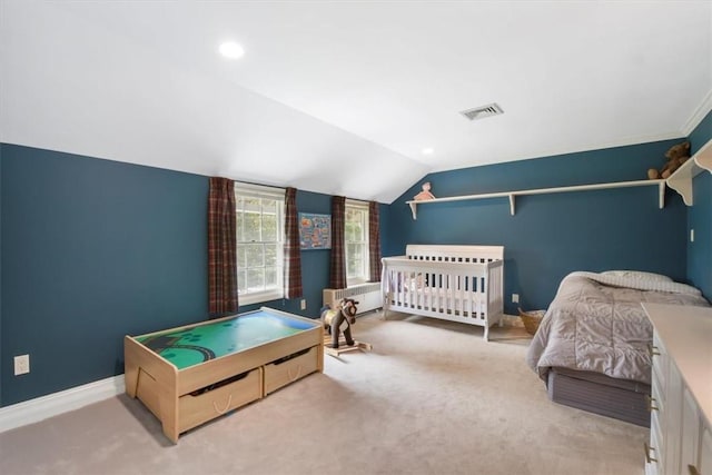 bedroom featuring lofted ceiling, radiator heating unit, and light carpet