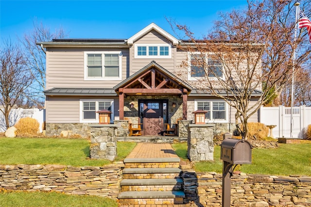 craftsman house with a front lawn