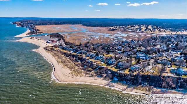 birds eye view of property featuring a water view and a view of the beach