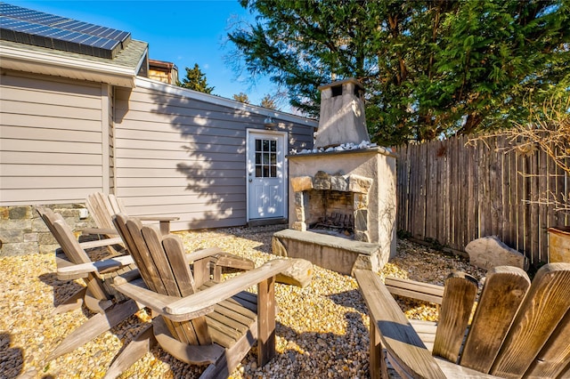 view of patio / terrace with an outdoor stone fireplace