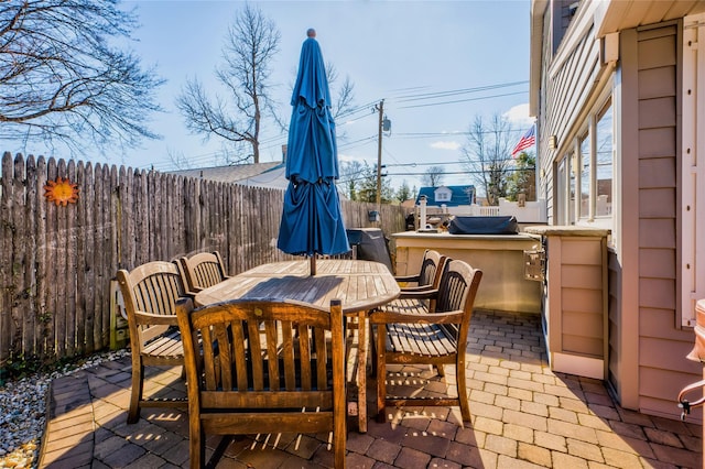 view of patio with exterior kitchen and exterior bar