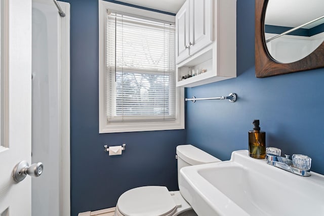 bathroom with toilet and sink