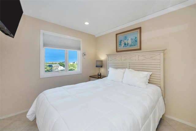 bedroom with light tile patterned floors