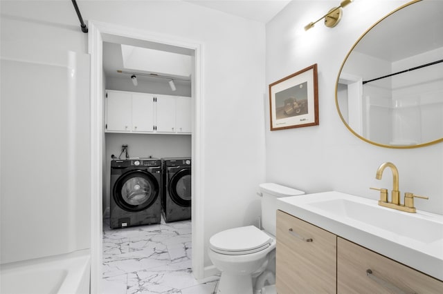 full bath with washing machine and dryer, toilet, vanity, marble finish floor, and walk in shower