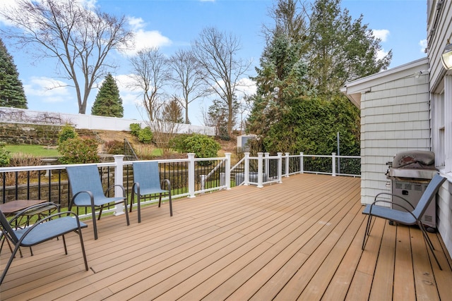 wooden deck featuring grilling area