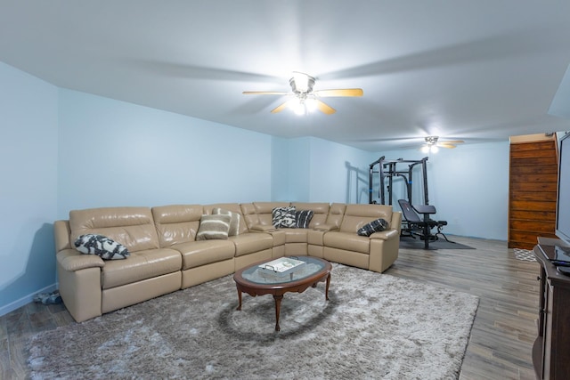 living area with ceiling fan and wood finished floors