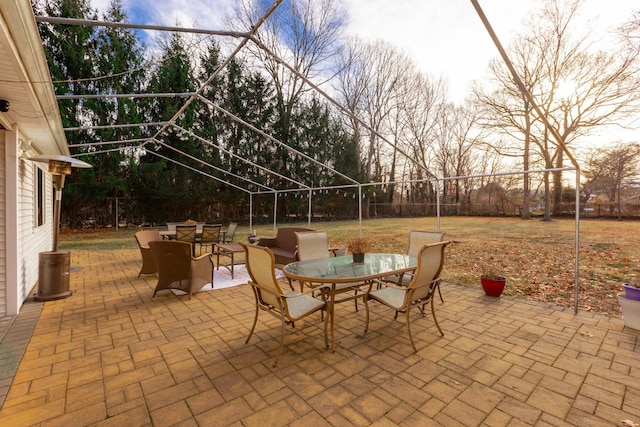 view of patio featuring outdoor dining area and fence