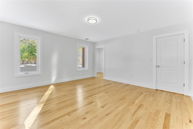 spare room featuring light hardwood / wood-style flooring