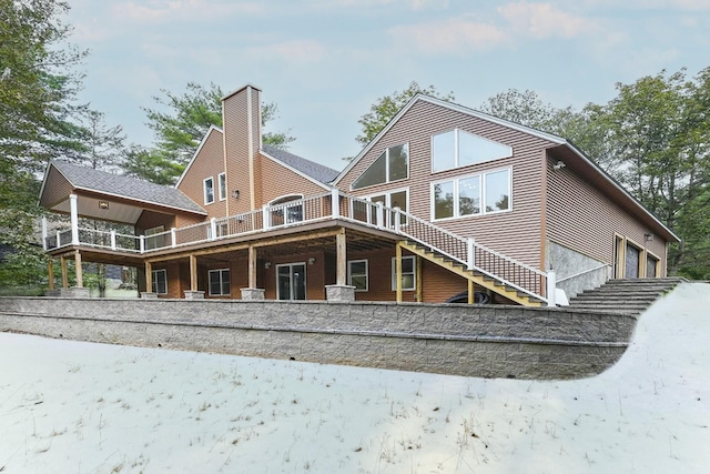 rear view of house featuring a garage