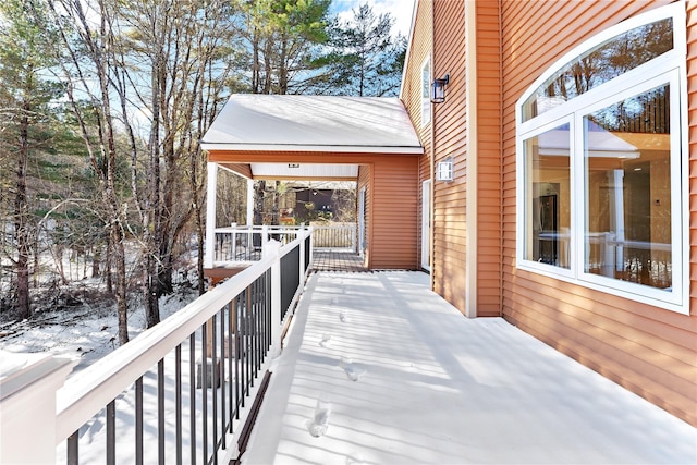 view of snow covered deck