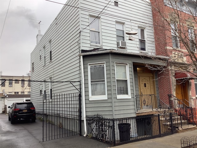 view of side of home featuring cooling unit