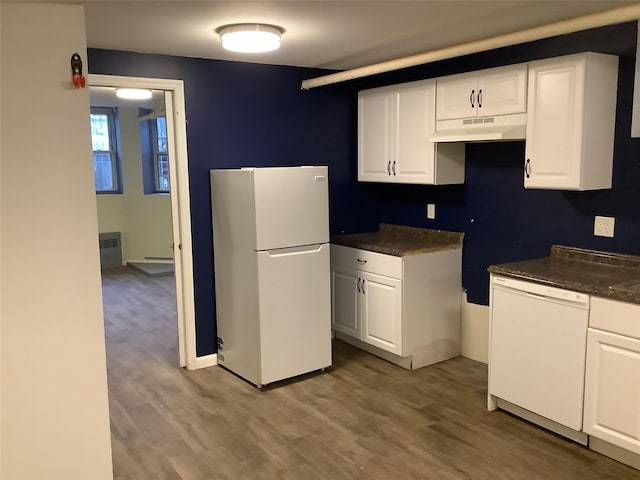 kitchen with white cabinetry, white appliances, and hardwood / wood-style flooring