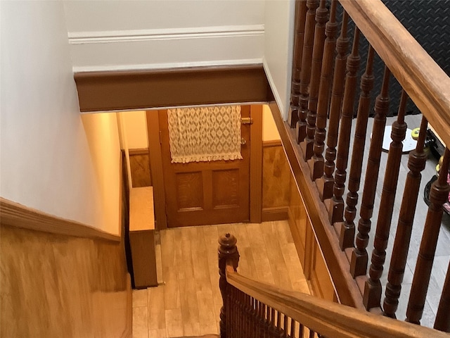 stairs with hardwood / wood-style flooring