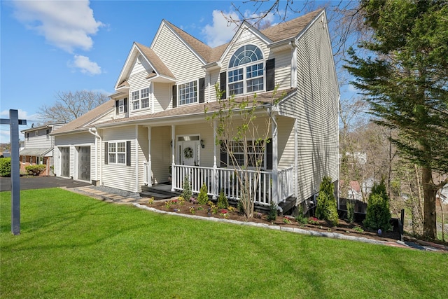 33 Potter Ln, Huntington, NY 11743 - traditional-style home featuring an attached garage, a front lawn, driveway, and covered porch