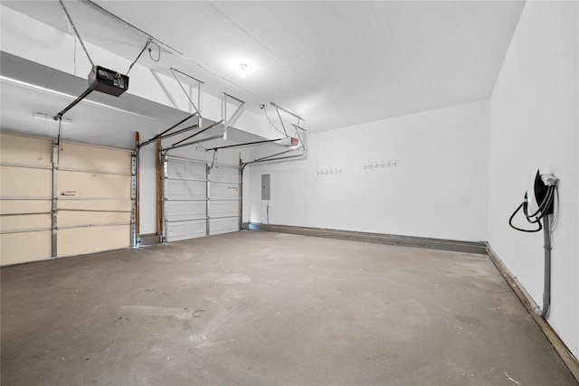 33 Potter Ln, Huntington, NY 11743 - garage with electric panel, baseboards, and a garage door opener