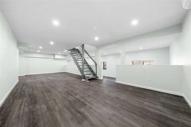 33 Potter Ln, Huntington, NY 11743 - basement with dark wood finished floors, stairway, and baseboards