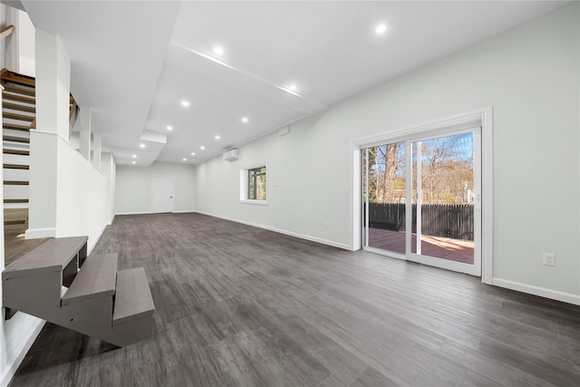 33 Potter Ln, Huntington, NY 11743 - unfurnished living room with dark wood-type flooring, baseboards, stairs, and recessed lighting