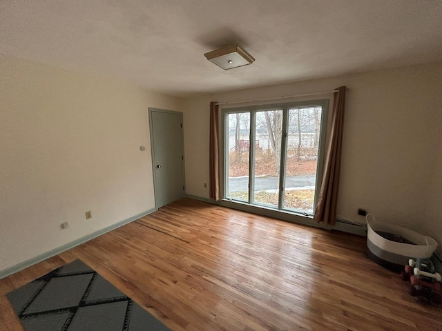 unfurnished room featuring wood-type flooring