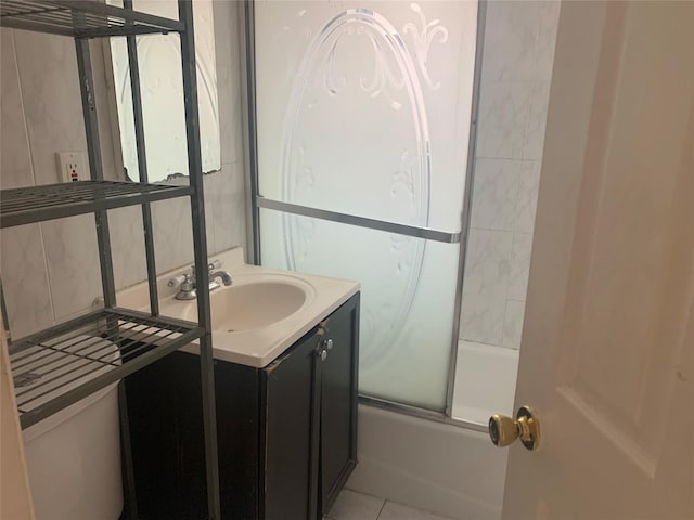 bathroom featuring vanity, decorative backsplash, bath / shower combo with glass door, and tile patterned floors