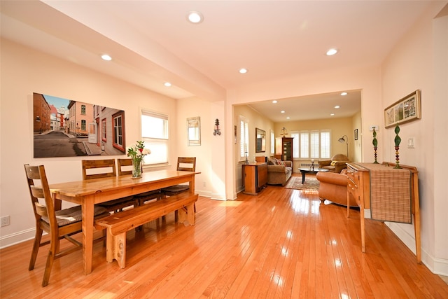 dining area with baseboards, light wood-style flooring, and recessed lighting