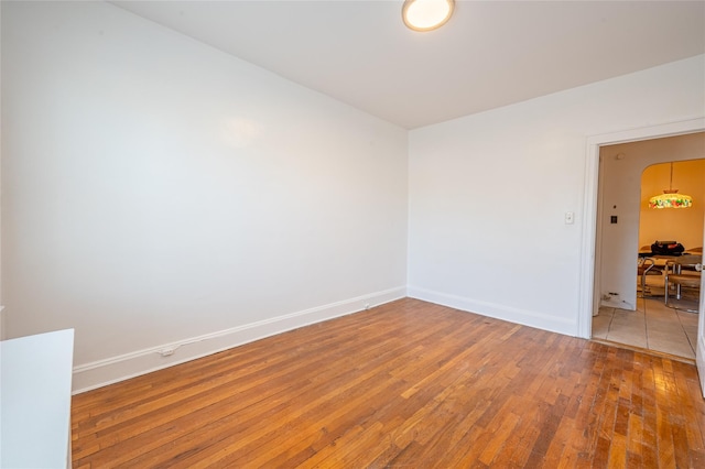 unfurnished room featuring hardwood / wood-style floors