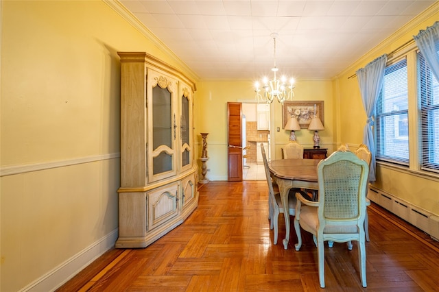 dining space with an inviting chandelier, parquet floors, ornamental molding, and a baseboard heating unit