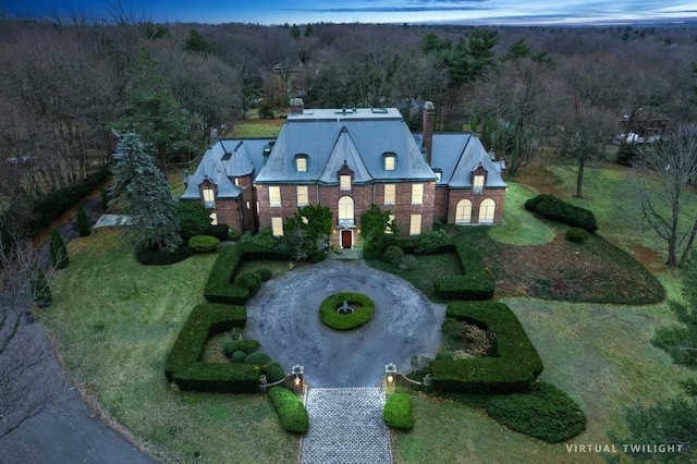 aerial view featuring a wooded view