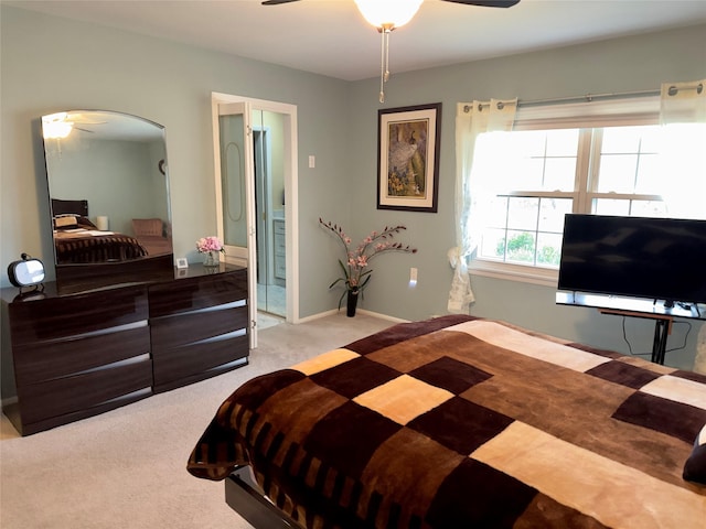 bedroom with ceiling fan and light colored carpet