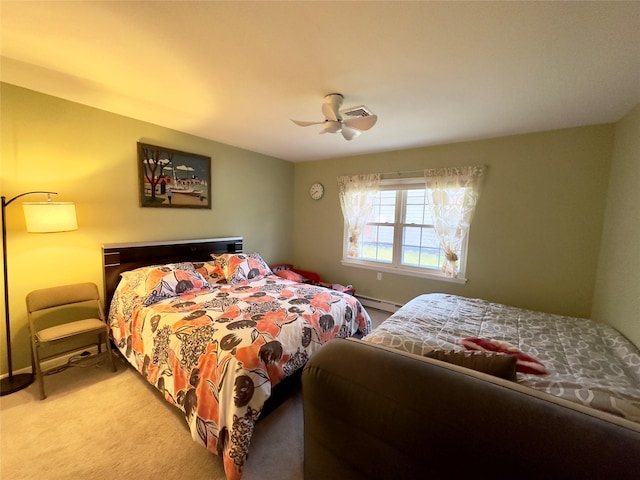 carpeted bedroom featuring ceiling fan and baseboard heating