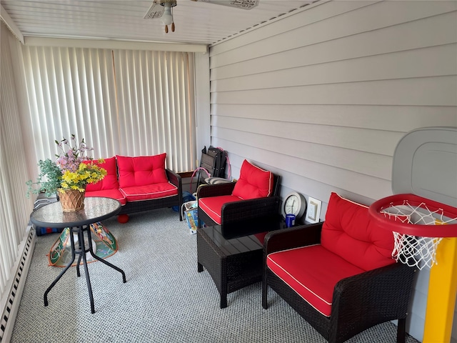 view of patio / terrace with outdoor lounge area, a baseboard heating unit, and ceiling fan