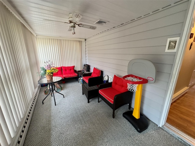 sunroom / solarium with ceiling fan