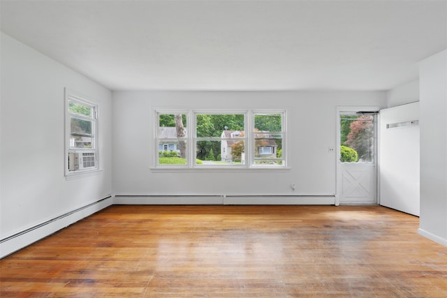 49 Pine Ave, Ossining, NY 10562 - empty room featuring light wood-type flooring and baseboard heating