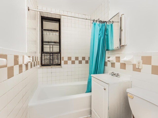 full bathroom featuring tile walls, vanity, shower / bath combo, and toilet