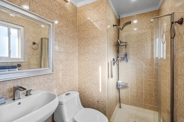 bathroom with walk in shower, toilet, sink, crown molding, and tile walls