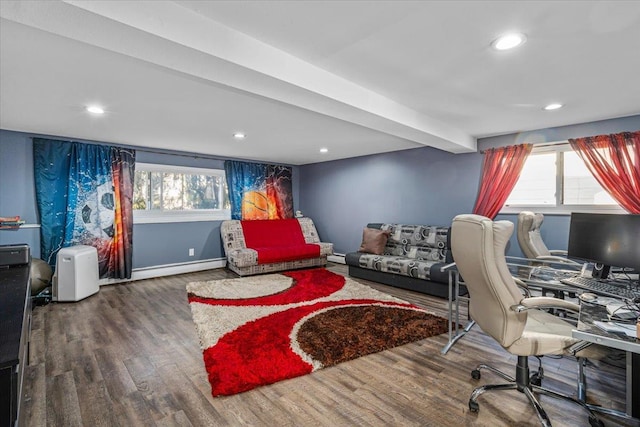 office with beamed ceiling, a baseboard heating unit, and hardwood / wood-style floors