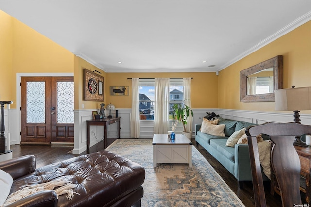 living room featuring dark hardwood / wood-style flooring, crown molding, and french doors