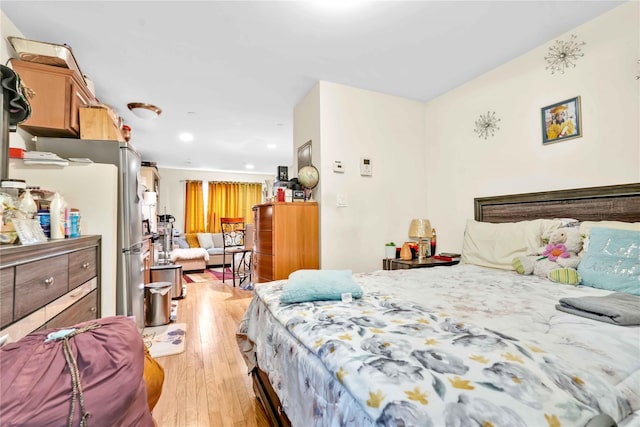 bedroom with light hardwood / wood-style floors