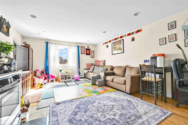 living room with light hardwood / wood-style floors