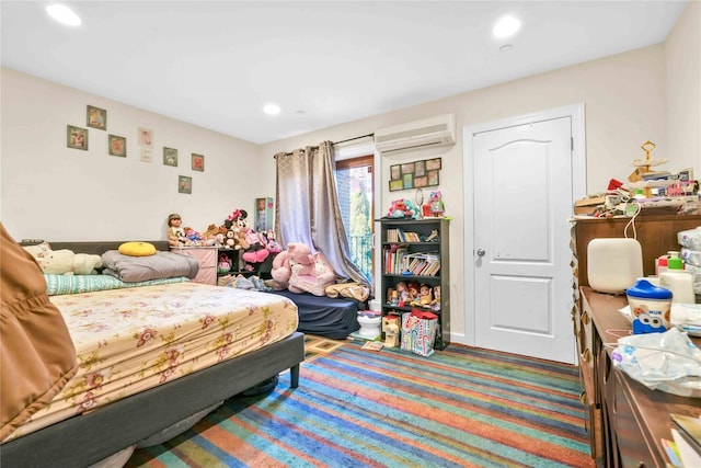 bedroom with a wall unit AC and carpet flooring