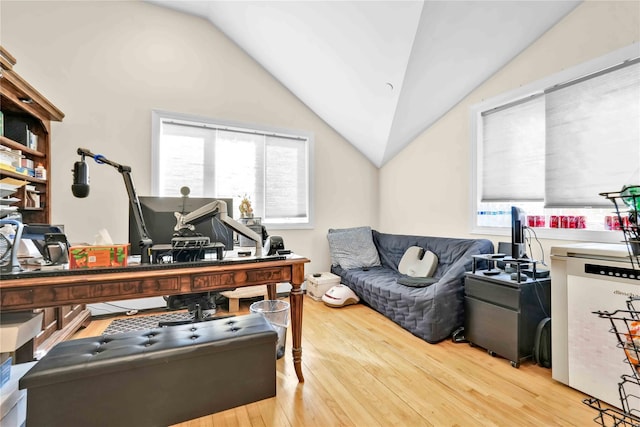 home office featuring hardwood / wood-style flooring and vaulted ceiling