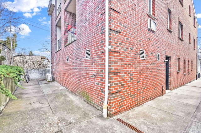 view of side of property featuring a patio