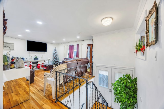 living room with wood-type flooring and crown molding