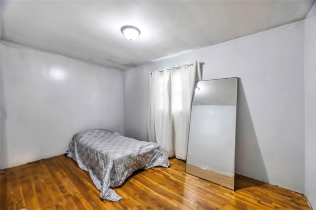 bedroom featuring dark wood-type flooring