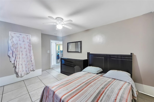 tiled bedroom with ceiling fan