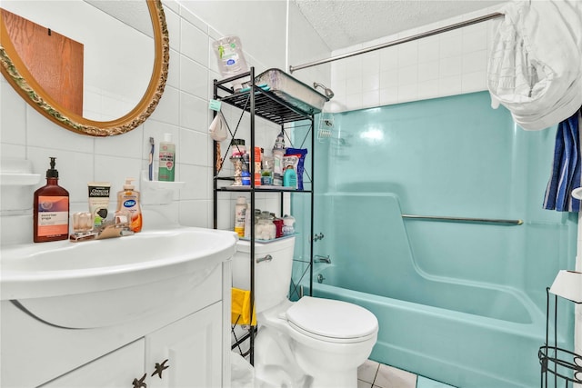 full bathroom featuring tile walls, backsplash, shower / bath combination, toilet, and tile patterned floors