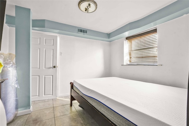 bedroom featuring light tile patterned floors