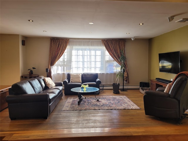 living room featuring hardwood / wood-style floors and a baseboard radiator